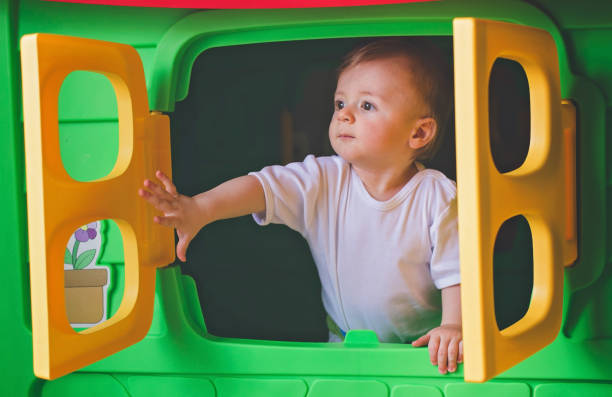 istock Baby playing in the playhouse 821791324