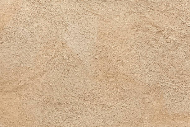 mur de stuc peint beige. - stucco photos et images de collection