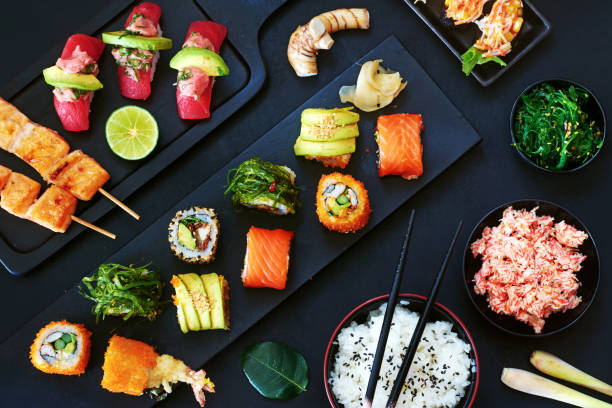 istock Stylish japanese dinner over dark background. 821792460