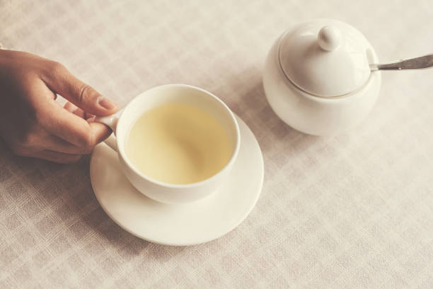 istock Cup of herbal tea standing on the table 821795892