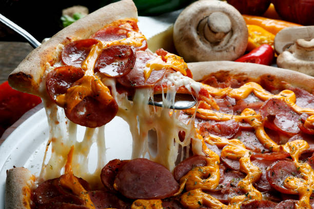 istock Slice of pizza raised 821798166