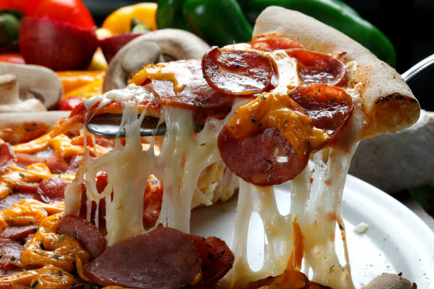 istock Slice of pizza raised 821798788