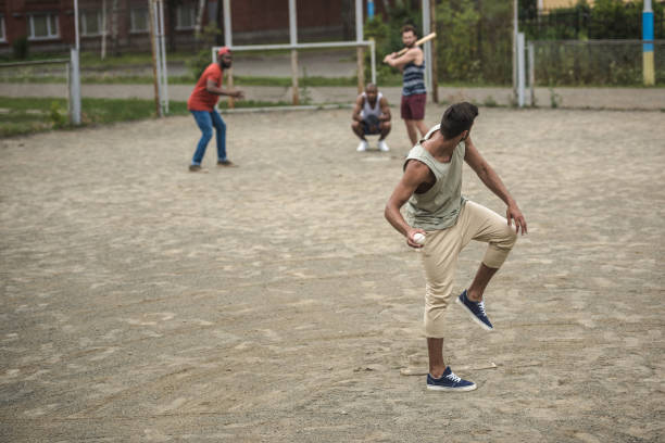 istock group of young multiethnic men playing baseball on court 821799508