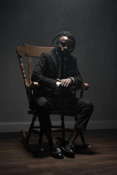 istock Stylish black man in rocking chair 821800260