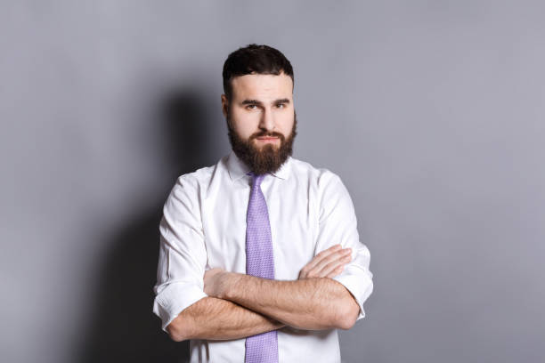 istock Confident businessman with crossed hands 821803630