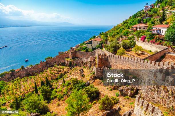 Beautiful Sea Panorama Landscape Of Alanya Castle In Antalya District Turkey Asia Famous Tourist Destination With High Mountains Summer Bright Day And Sea Shore Stock Photo - Download Image Now