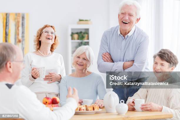 People Laughing Together Stock Photo - Download Image Now - Senior Adult, Friendship, Coffee - Drink