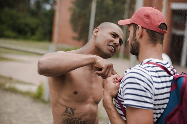 istock Side view portrait of two young men having conflict 821808460