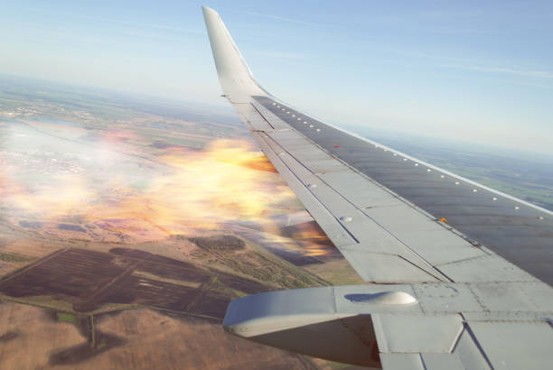 Burning wing of the plane, the plane falling, Burning wing of the plane, the plane falling, the view from the window of the aircraft, the emergency situation on Board a passenger liner engine failure stock pictures, royalty-free photos & images