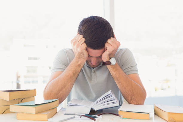 istock Stressed casual businessman studying at his desk i 821812092
