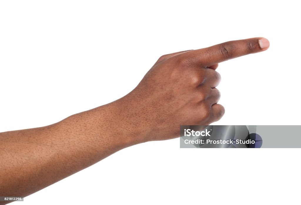 Hand gestures - man pointing away, isolated Black male hand point finger. Hand gestures - man pointing on virtual object with forefinger, isolated on white background Pointing Stock Photo