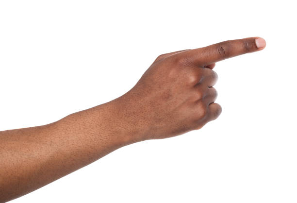 Hand gestures - man pointing away, isolated Black male hand point finger. Hand gestures - man pointing on virtual object with forefinger, isolated on white background hand pointing stock pictures, royalty-free photos & images