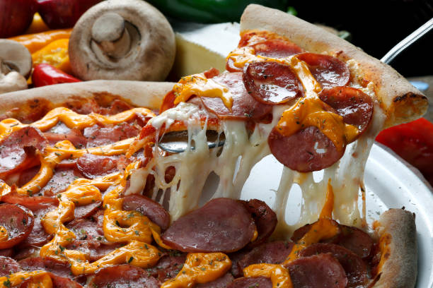 istock Slice of pizza raised 821812490