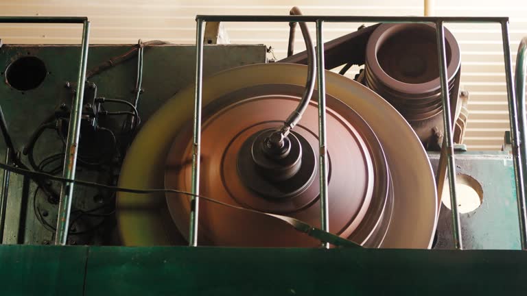 The machine cuts the sheet metal. Large hydraulic guillotine shears.