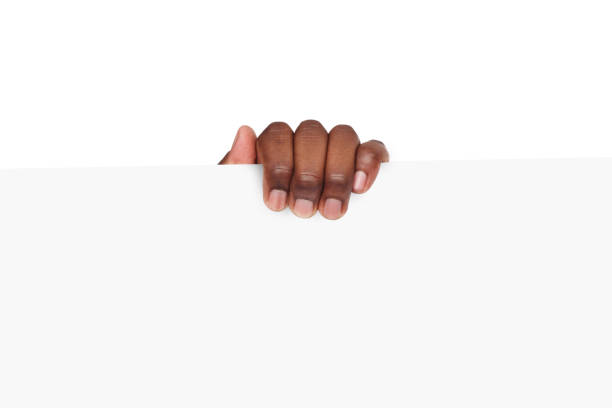 istock Black hand holding blank advertising card 821812748