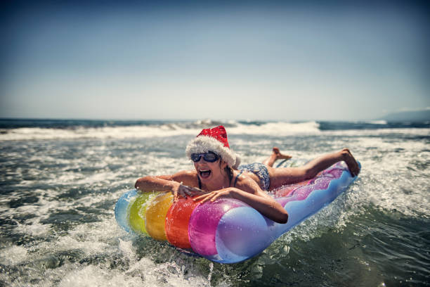 istock Little girl spending summer christmas on beach 821814950