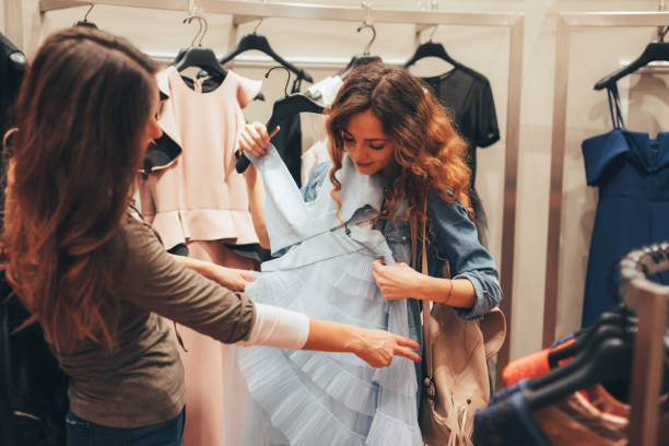 istock Two friends shopping for clothes 821819864