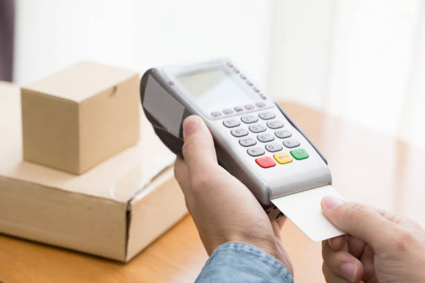istock POS terminal confirms the payment by debit credit card 821819956
