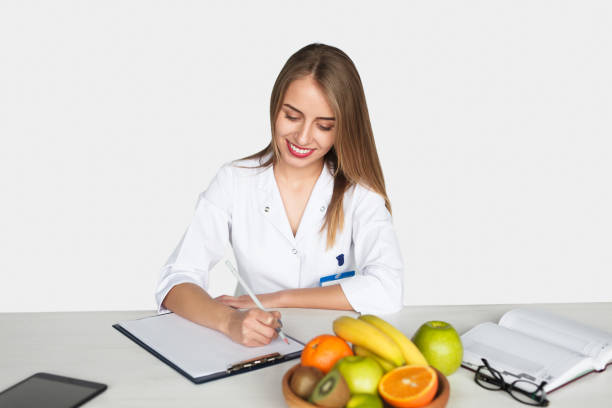 istock Woman writing in char holder by table 821820960