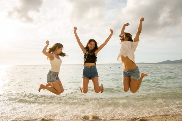 istock Young people having fun on the beach at sunset. 821821190
