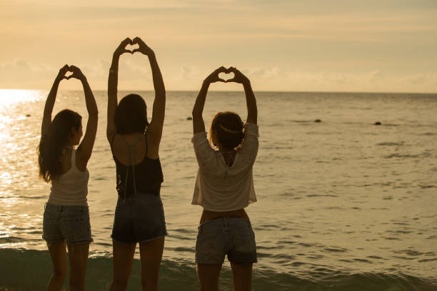 istock Young people having fun on the beach at sunset. 821821254