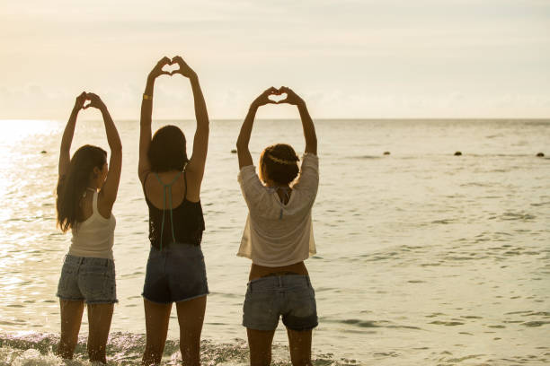 istock Young people having fun on the beach at sunset. 821821354