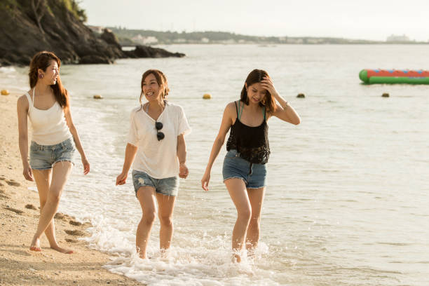 istock Young people having fun on the beach at sunset. 821821430
