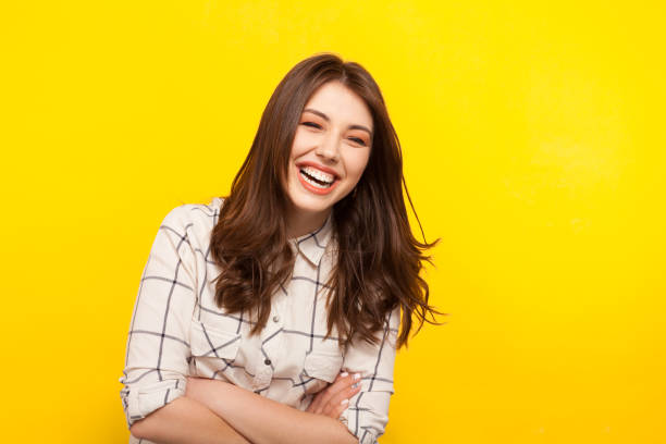 istock Laughing woman with hands crossed 821824686