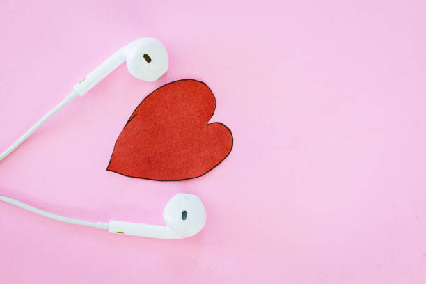 istock Headphones and heart on pink background 821824966