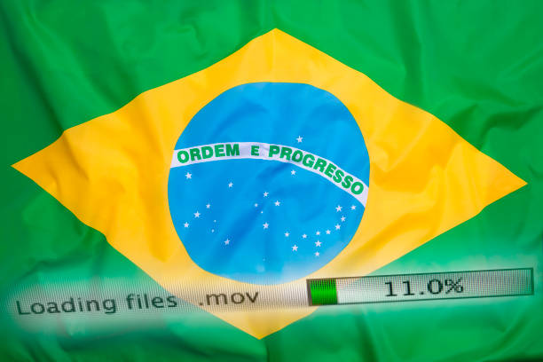 istock Downloading files on a computer, Brazil flag 821827484