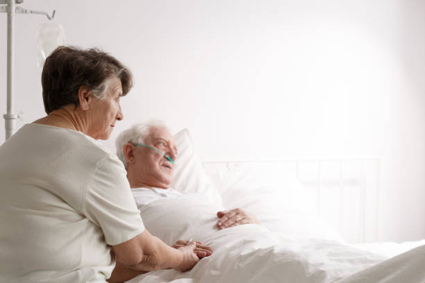istock Senior woman supporting sick husband 821828238