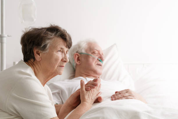 istock Senior woman and her dying husband 821828538