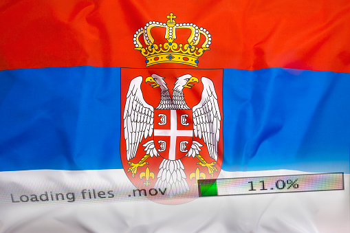 Downloading files on a computer with Serbia flag
