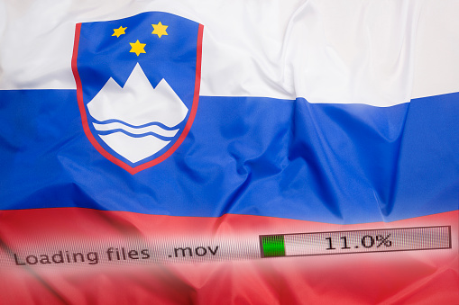 Downloading files on a computer with Slovenia flag