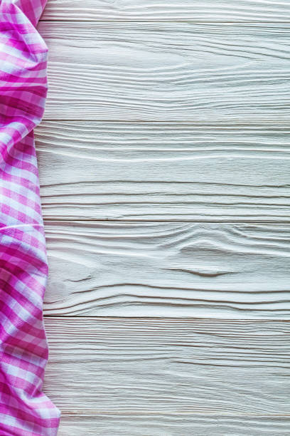 istock Pink cotton tablecloth on wooden board 821833758