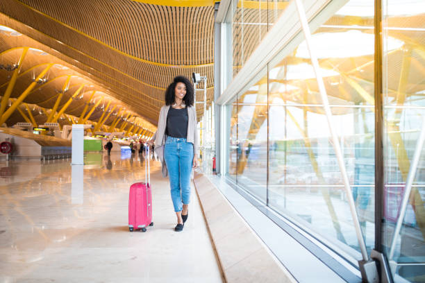 istock woman front walking at the airport 821836696