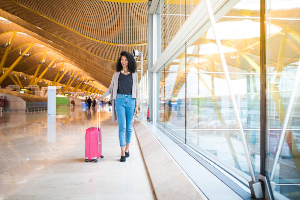 istock woman front walking at the airport 821836736
