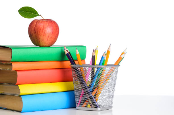 школьные аксессуары на белом - textbook book apple school supplies стоковые фото и изображения