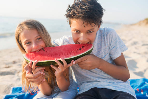 istock Children at the beach 821840416