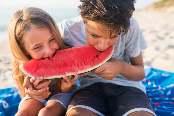 istock Children at the beach 821840528