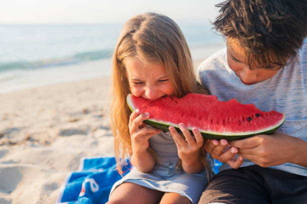 istock Children at the beach 821840758