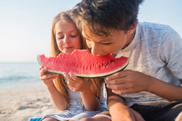 istock Children at the beach 821840804