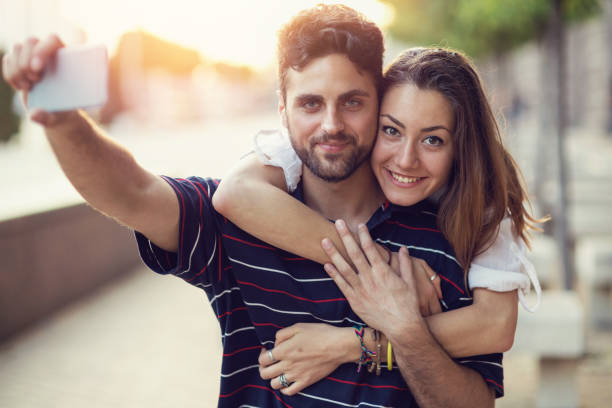 istock Couple making selfies on the street 821848738