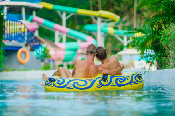 istock Homosexual couple - men - having fun in waterpark 821852318