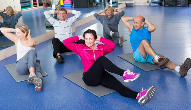 istock people training in a gym on sport mats 821852608