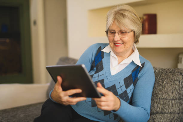 istock Senior woman using digital tablet at home 821852664