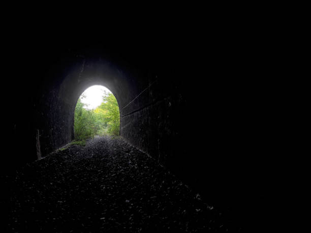 istock Realistic light at the end of the tunnel. Exit etc. 821852888