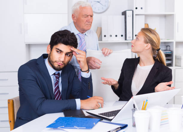 istock Mature businessman is chastising employees because of uncompleted work 821852938