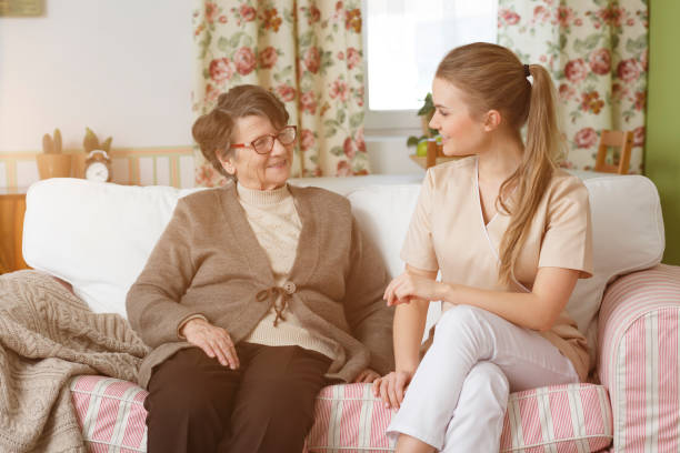istock Senior sitting with her nurse 821853380