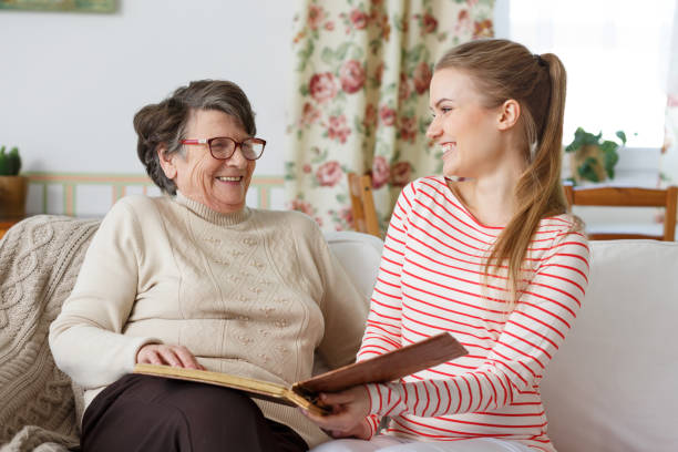 Grandma laughing with her granddaughter Happy grandma laughing with her young pretty granddaughter teenage girl with grandmother stock pictures, royalty-free photos & images